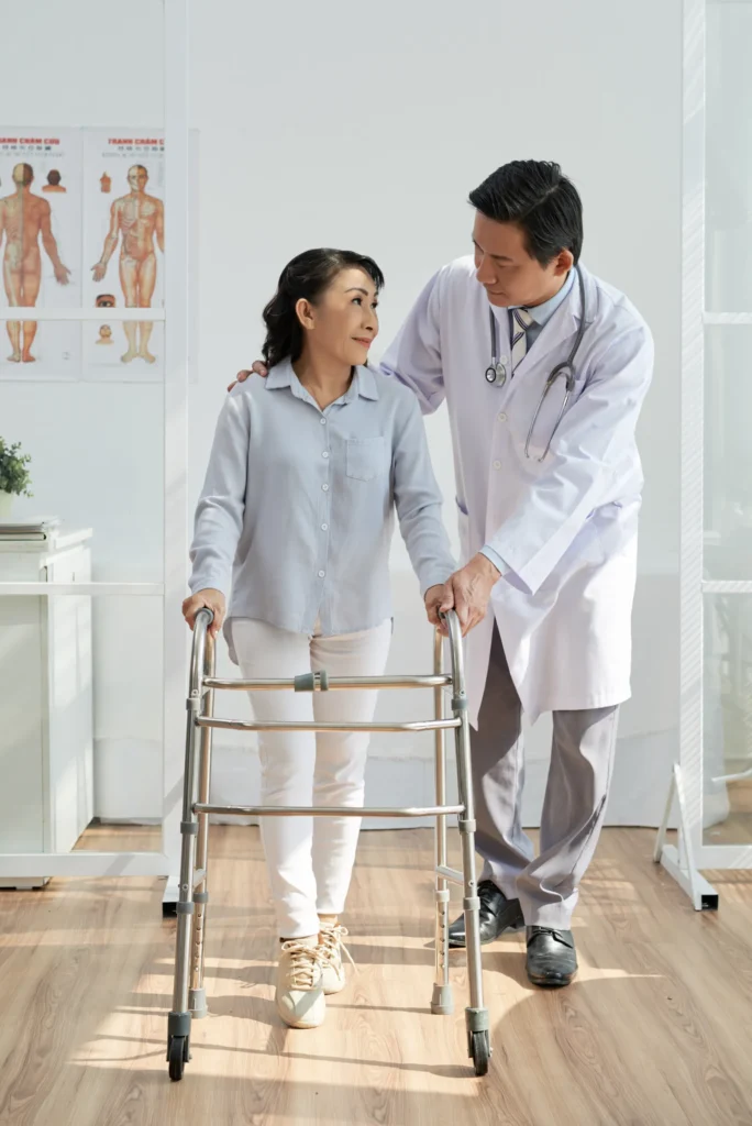 Therapist guiding patient through physical therapy exercises