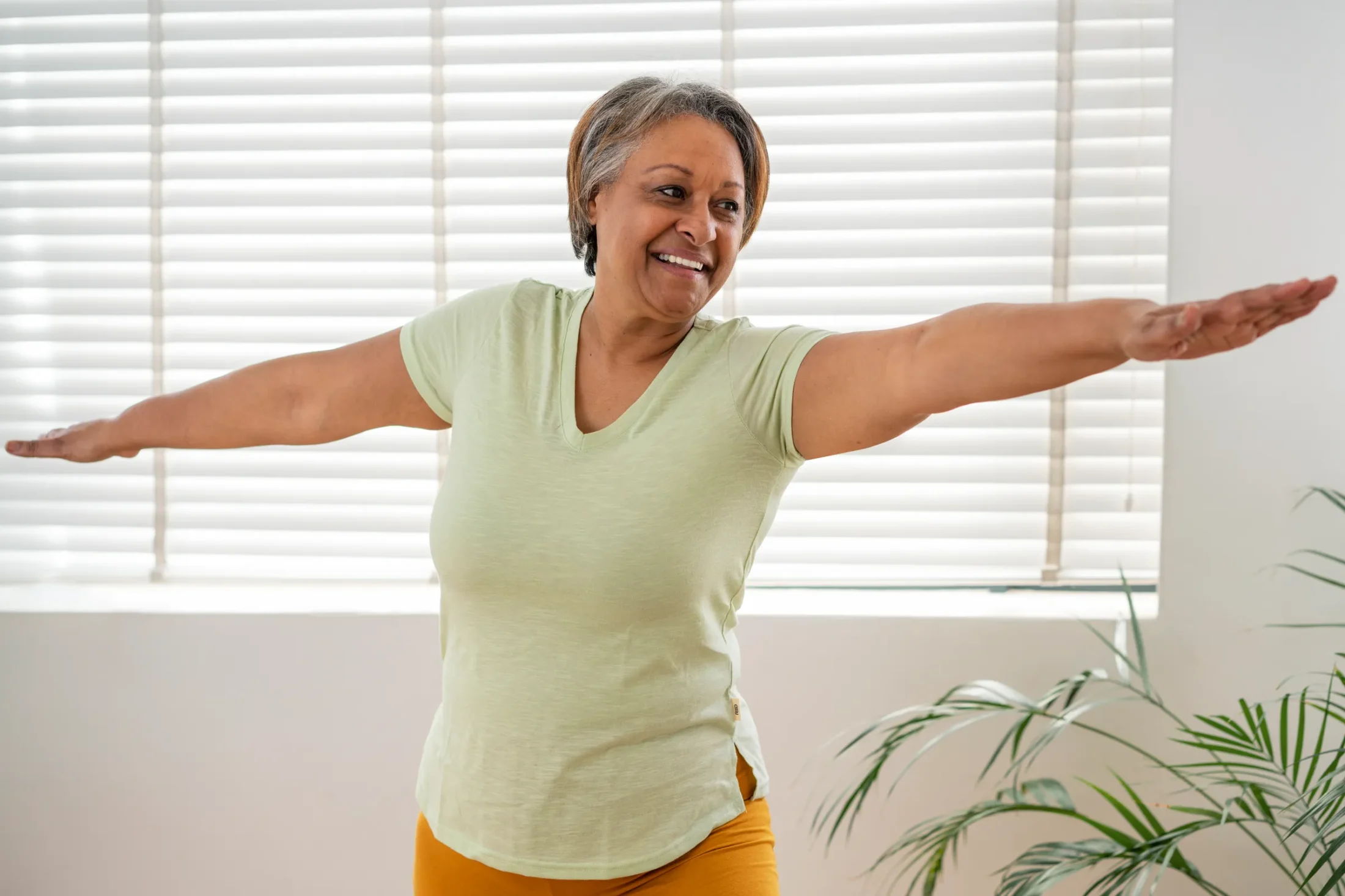 Smiling woman posing confidently facing the camera