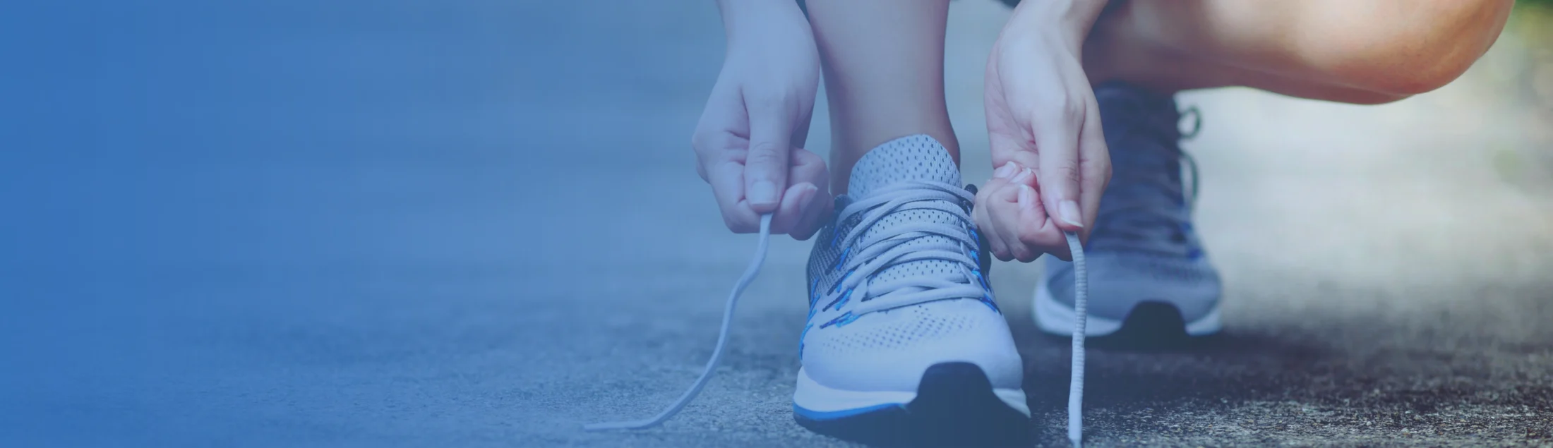 Woman tying shoes